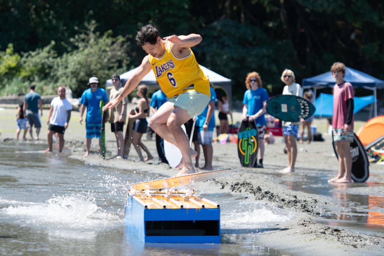 Skimboarder clearing a ramp at Beachfest