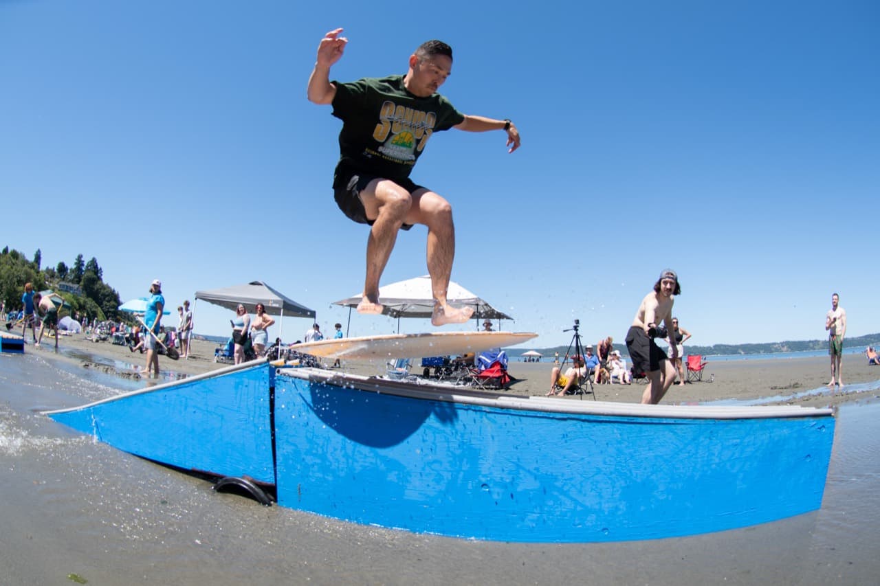 Beachfest competitor over a blue course feature